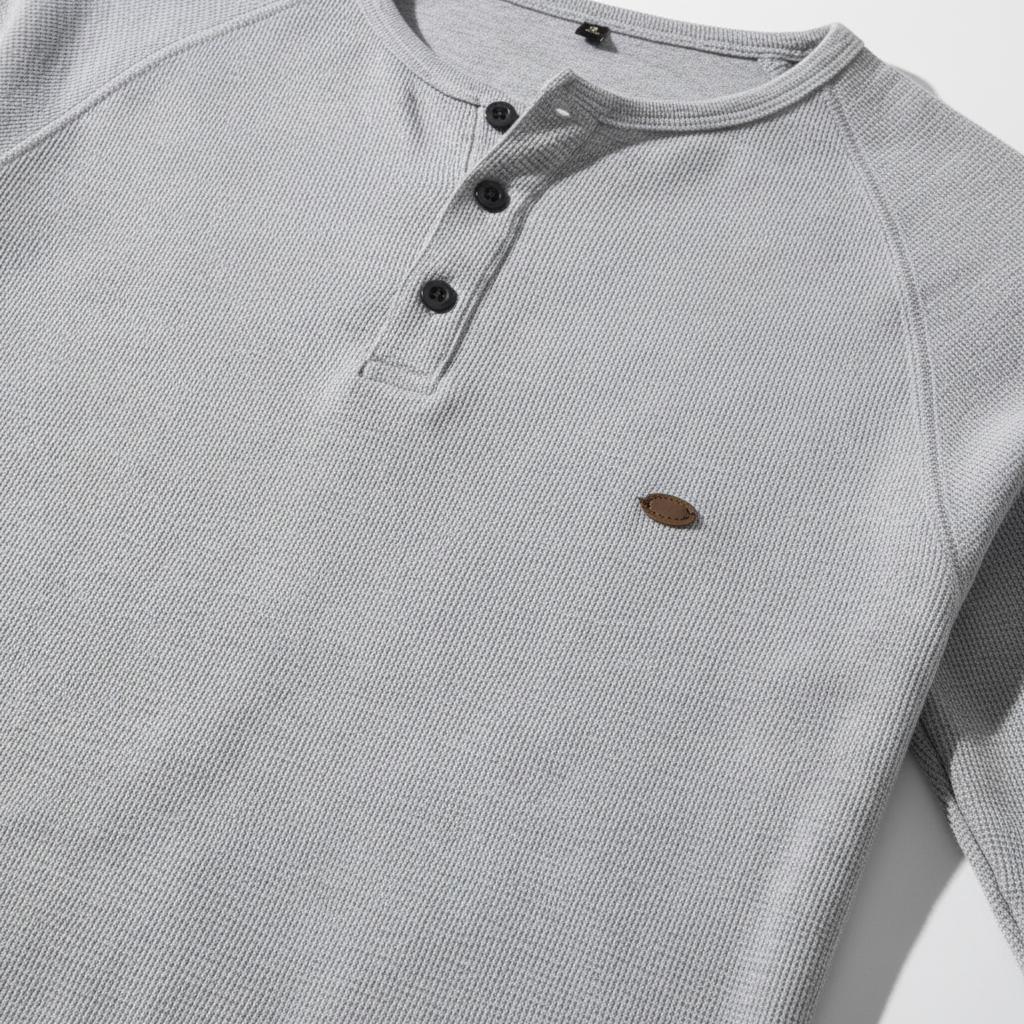 Close-up of the breathable cotton-poly fabric texture of a men's long sleeve button-up shirt, casual.