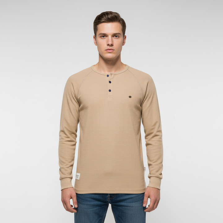 Folded Theo men's long sleeve button-up shirt, navy, showcasing the breathable and versatile design.