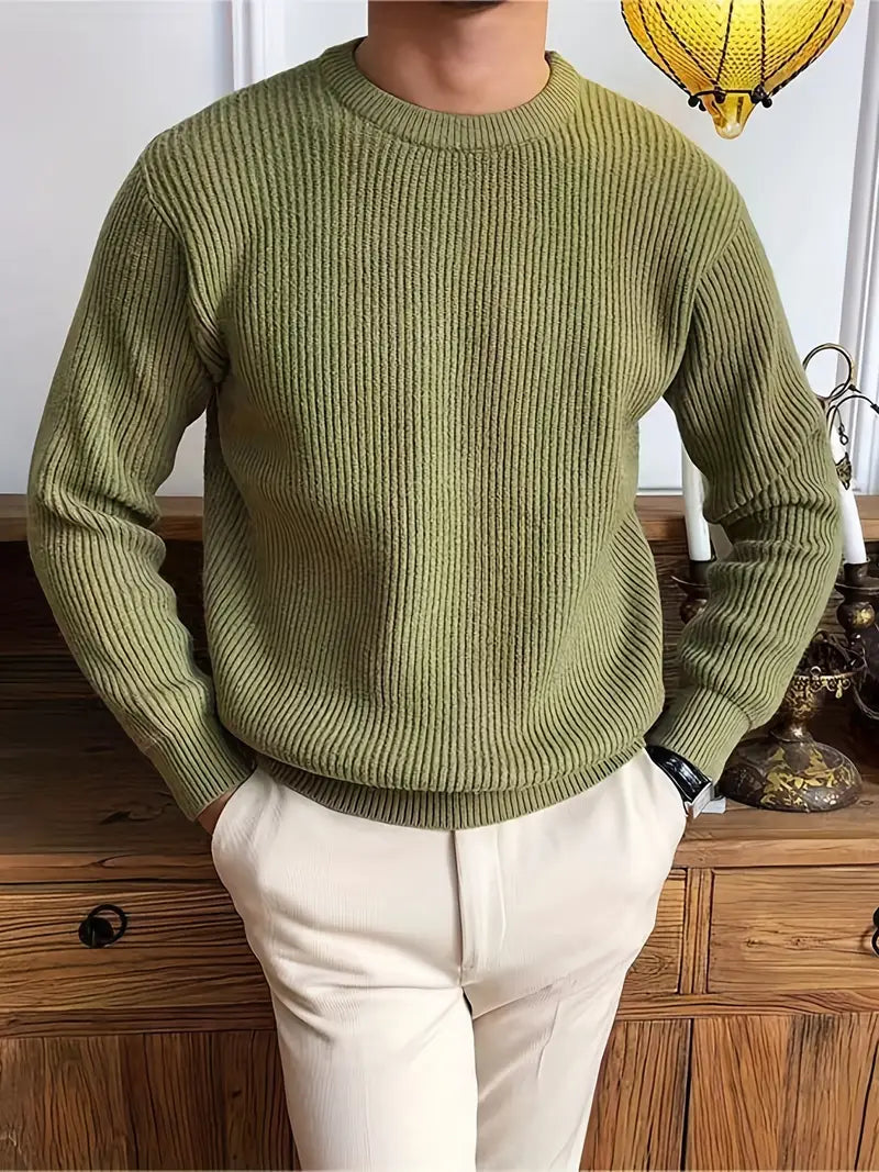 Close-up of a men's knit crew neck sweater texture, showcasing quality and comfortable fabric for fall.