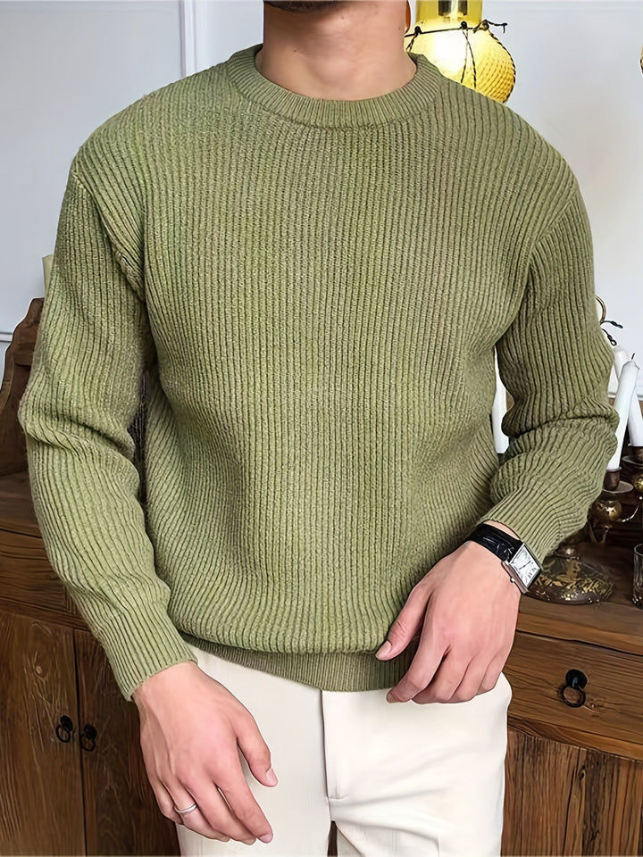 Man wearing a comfortable men's crew neck knit sweater, styled for a modern casual fall outfit.