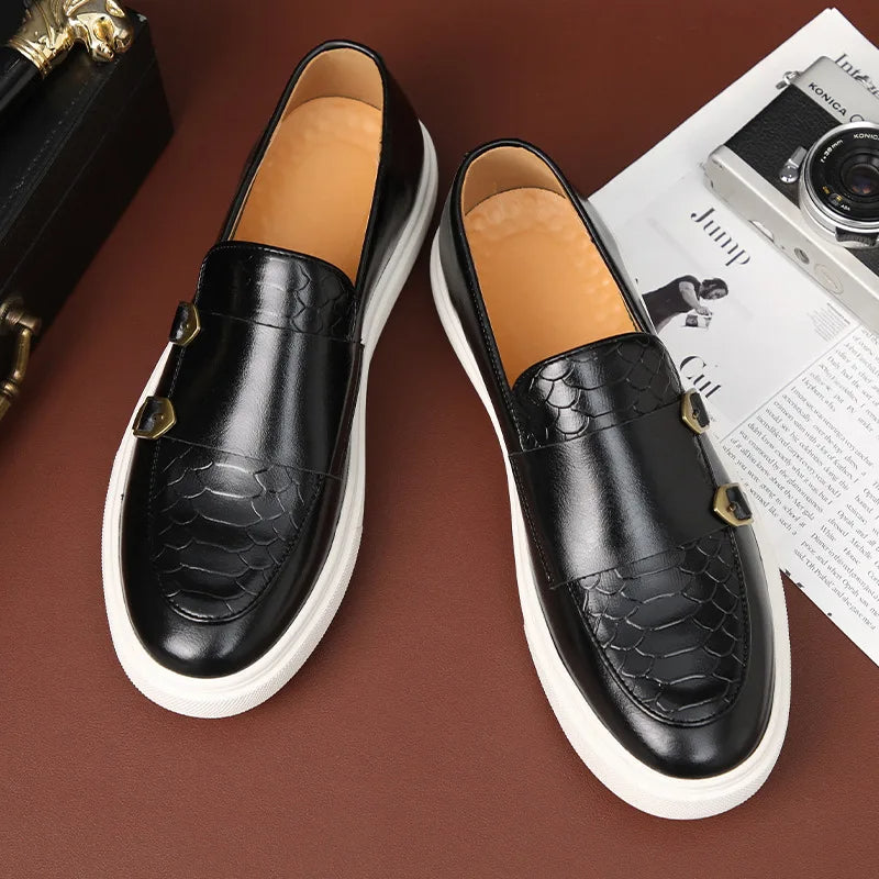 Close-up of men's sleek croc-embossed slip-on loafers, showcasing intricate leather texture & modern design.