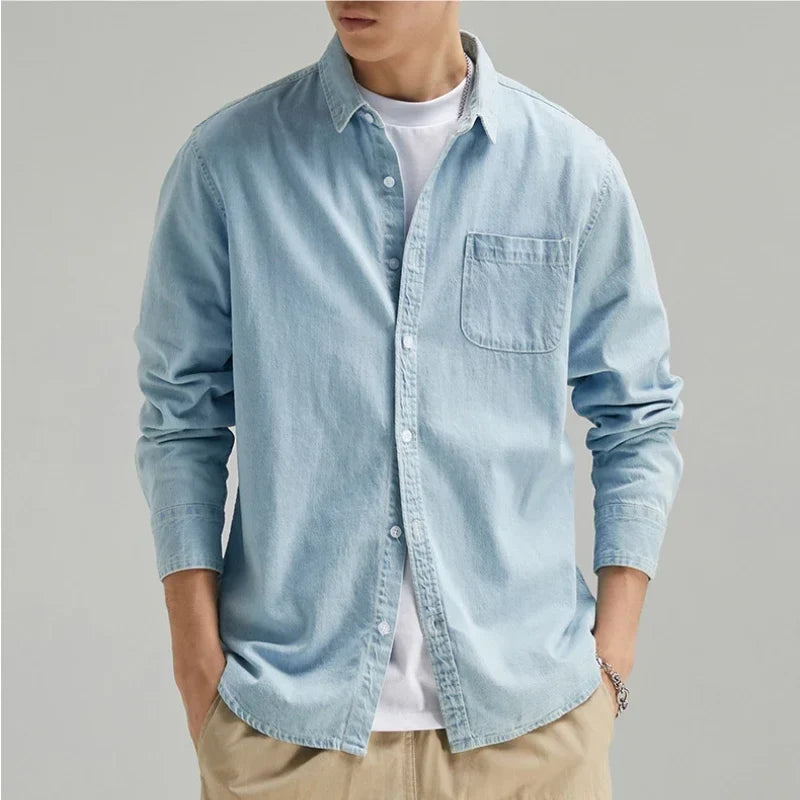 Men's blue denim button-down shirt with long sleeves, classic fit for comfortable casual wear.