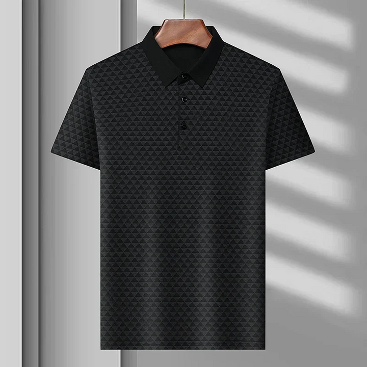 Men's diamond pattern polo shirt styled with jeans, a versatile and classic choice for modern casual fashion.