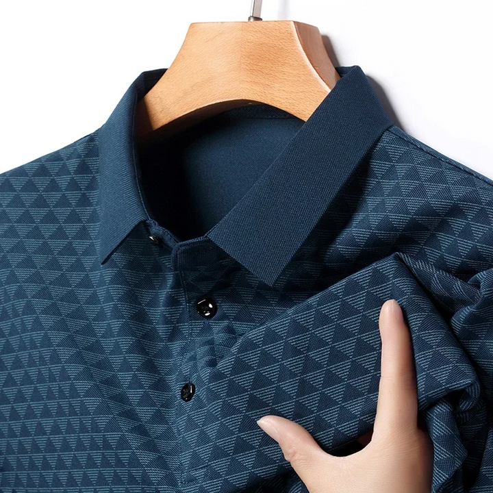 Detail of the button-up collar on a men's classic diamond pattern polo shirt, showcasing refined casual style.