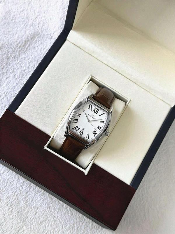 Men's dress watch on wrist, classic tonneau design with date, an elegant accessory for the modern gentleman.