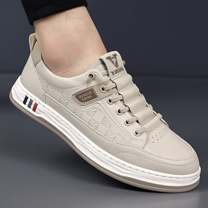Comfortable men's white casual sneakers, essential for everyday fashion.