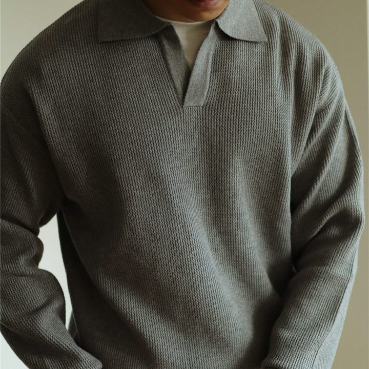 Classic fit men's polo shirt with soft knit fabric, ideal for versatile casual wear.