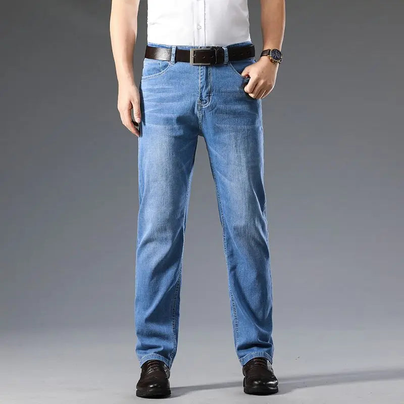 Close-up of comfortable cotton blend stretch denim fabric of men's blue classic fit jeans.