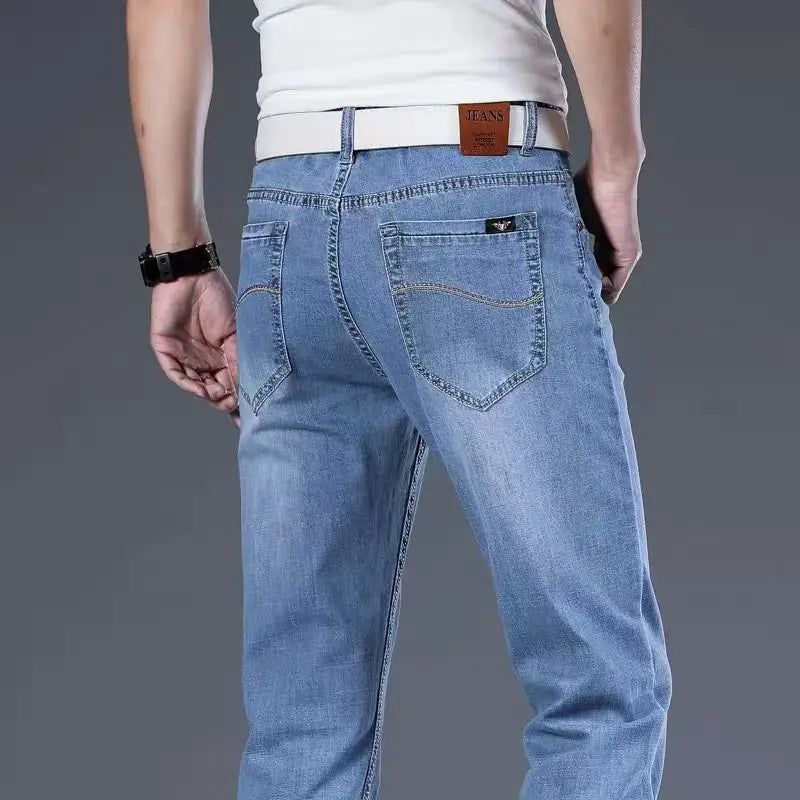 Men's classic fit light blue stretch denim jeans, versatile and comfortable for casual men's fashion.