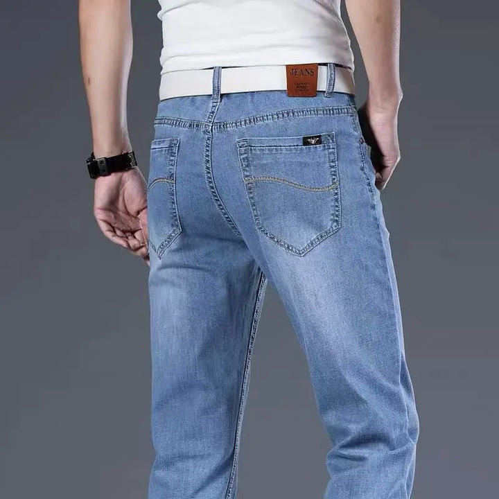 Men's classic fit light blue stretch denim jeans, versatile and comfortable for casual men's fashion.