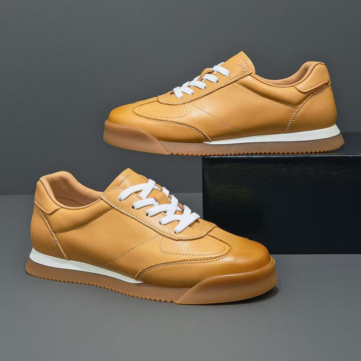 White men's classic leather sneakers, ideal for casual & refined everyday wear.