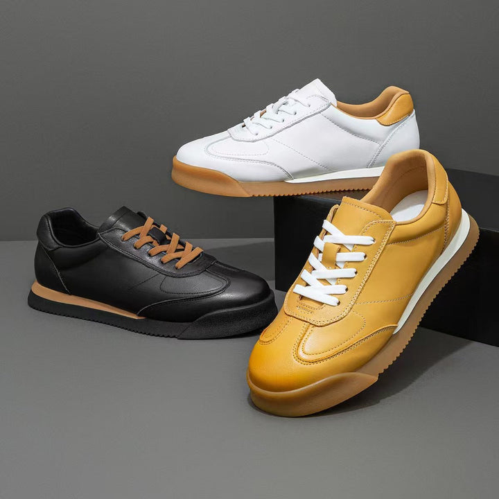 Black genuine leather men's sneakers, offering classic style & comfortable everyday footwear.