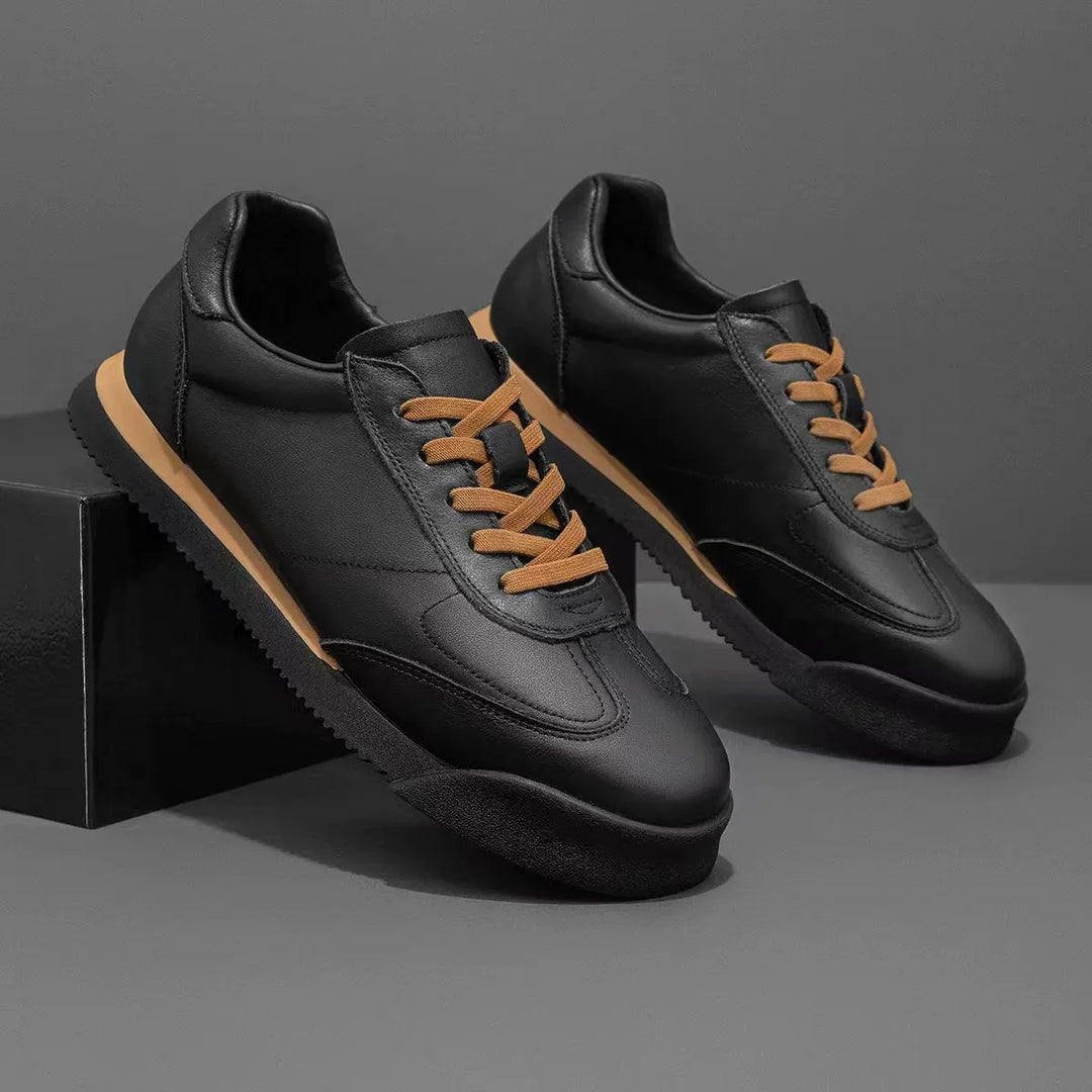 Comfortable men's classic leather sneakers, perfect casual footwear for refined everyday style.