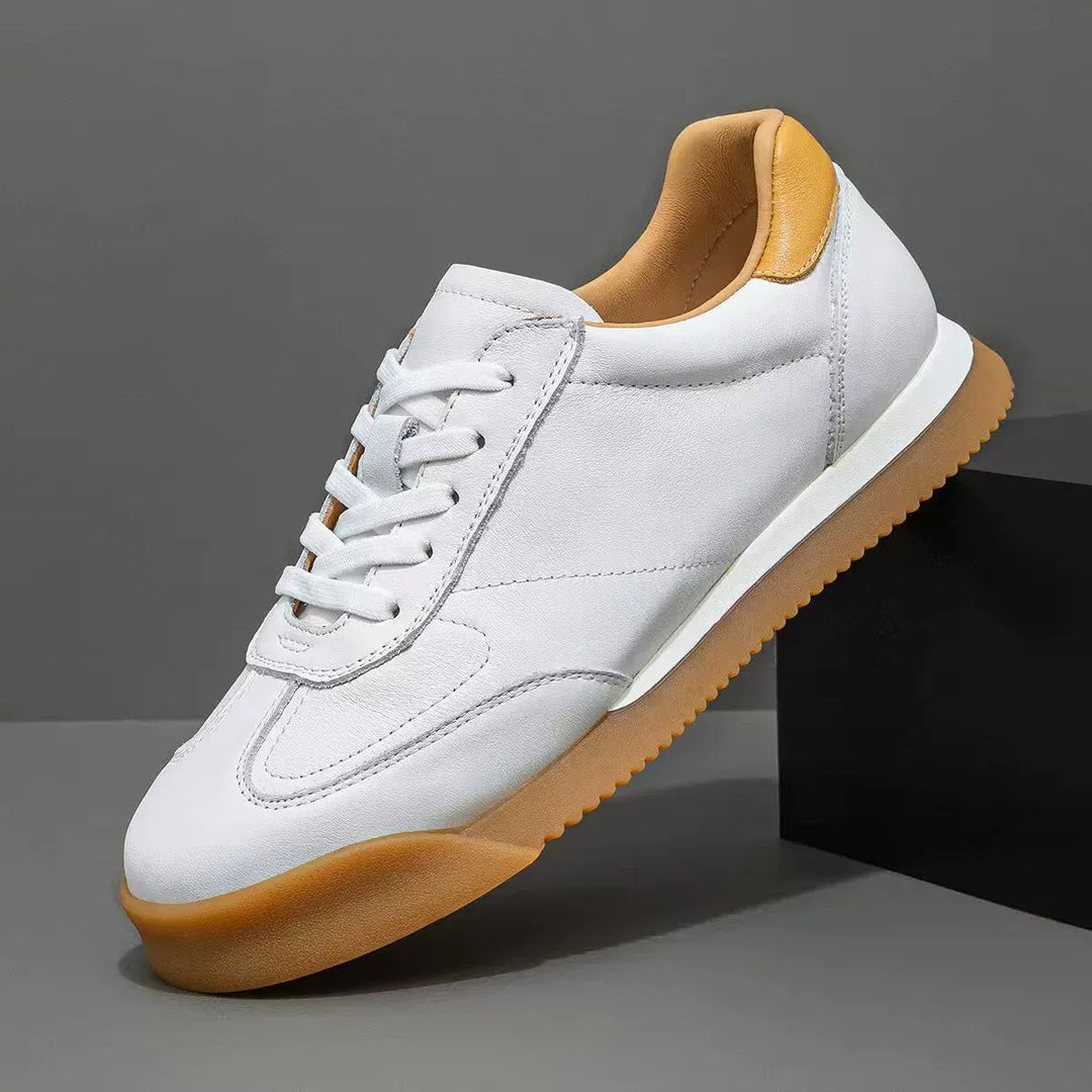 Premium genuine leather men's sneakers, offering classic style & comfortable everyday footwear.