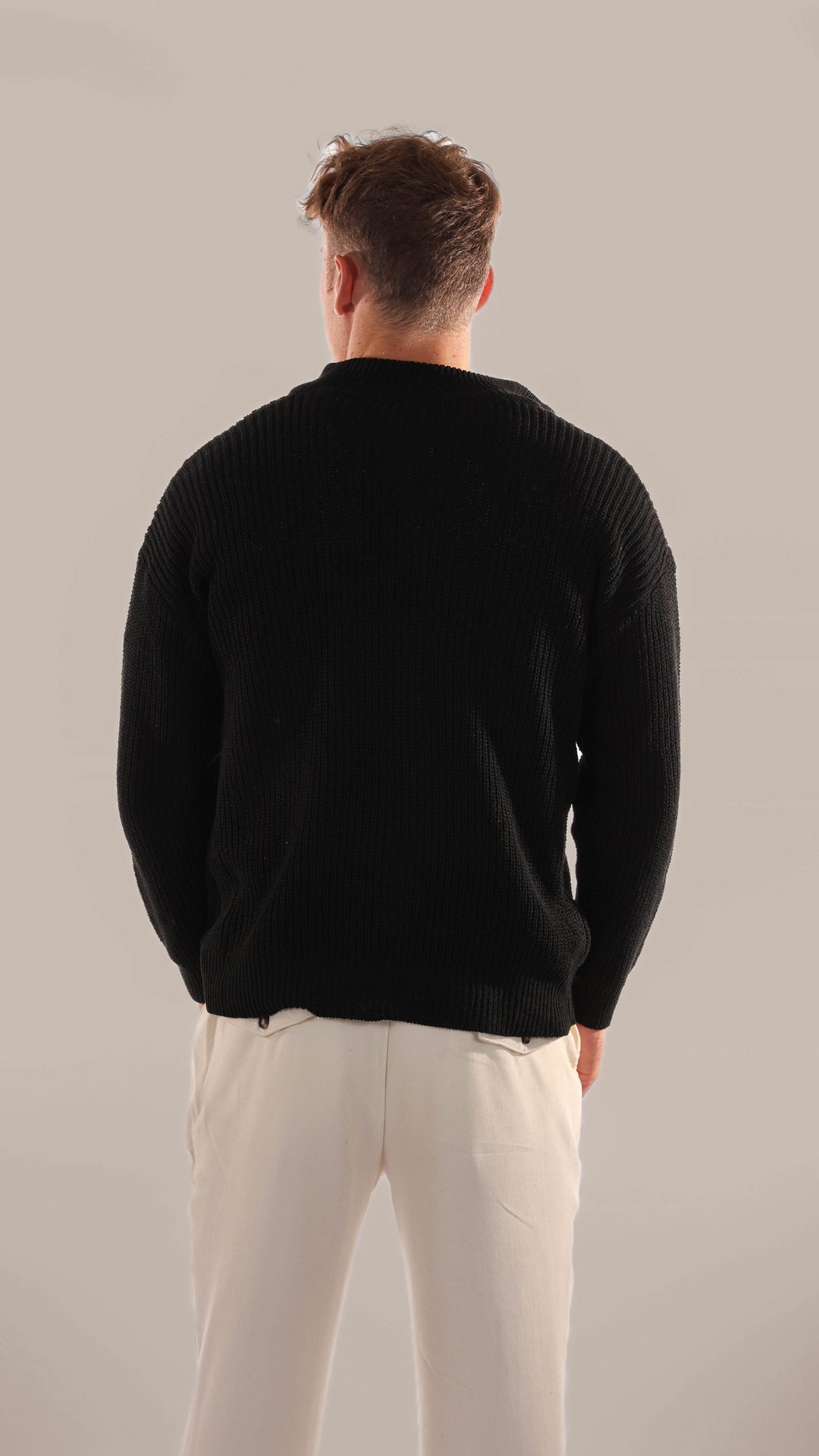 Comfortable men's half-zip pullover sweater, versatile for everyday casual wear.
