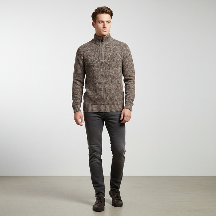 Close-up of men's half-zip pullover sweater, showing stand collar and ribbed cuffs, perfect for layering