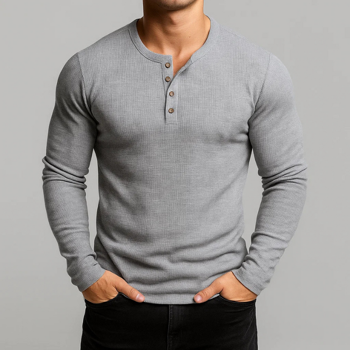 Casual men's long sleeve Henley shirt with a classic tailored fit, offering everyday comfort & style for menswear.