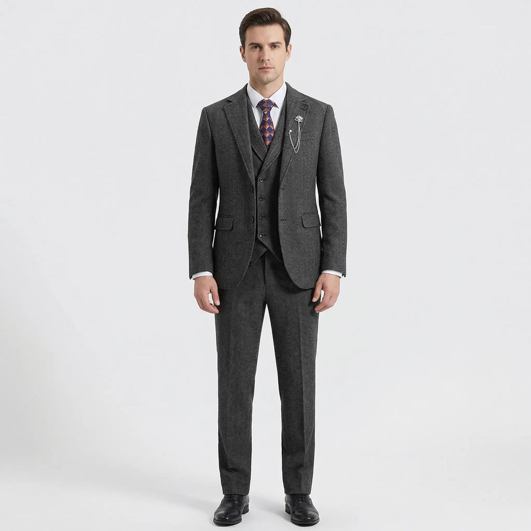 Close-up of men's herringbone pattern 3-piece suit fabric, showcasing classic texture.