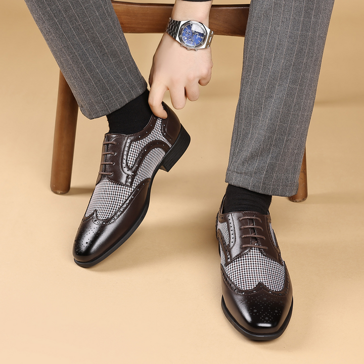 Top-down view of men's classic houndstooth oxford shoes, highlighting the intricate brogue pattern.