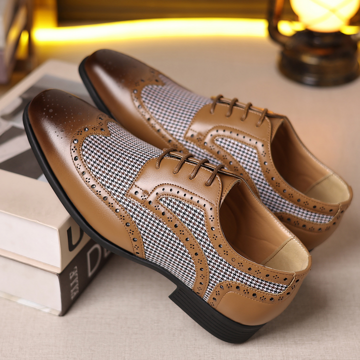 Classic houndstooth men's dress shoes, featuring a sleek wingtip design. Ideal for formal & casual outfits.