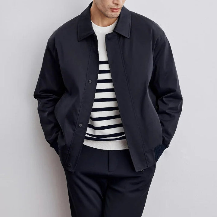 Stylish men's Harrington jacket, showcasing its classic collar, zip closure & comfortable lightweight fabric.