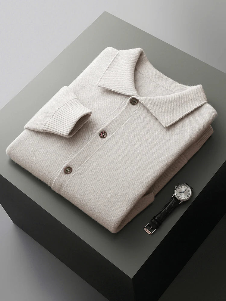 Close-up of a men's charcoal gray knit cardigan, highlighting soft texture, polo collar, and button-front details.