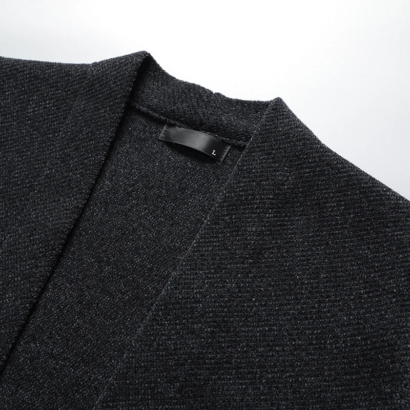 Dark gray men's knit cardigan, classic stripe detail. Versatile layer for men's fall & winter fashion.