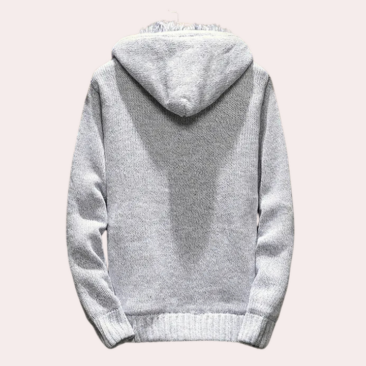 Comfortable men's knitted hooded vest, ideal as a layering piece. All-season casual outerwear for stylish men.