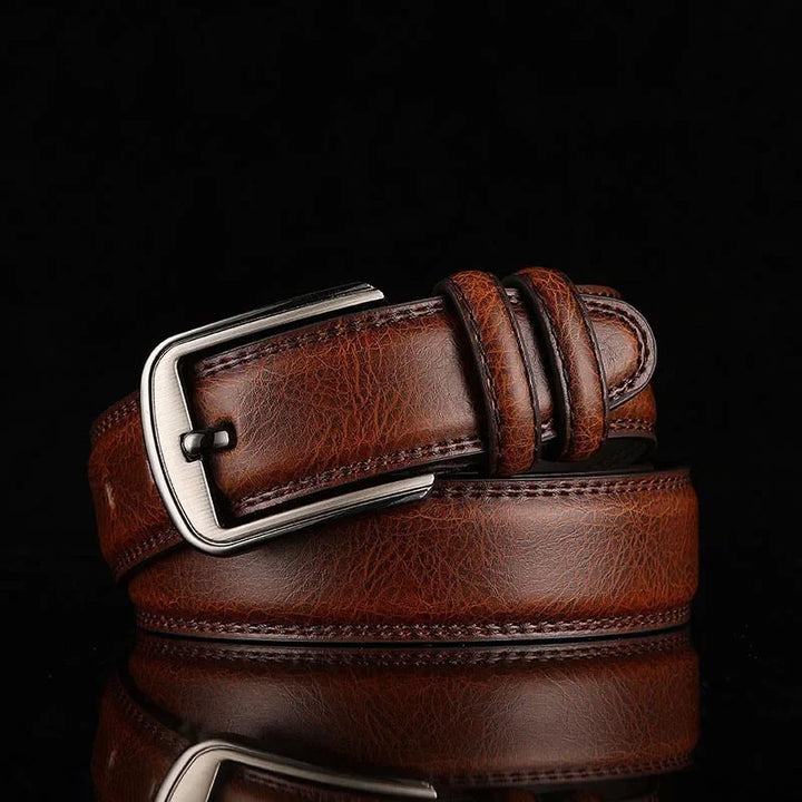 Men's classic leather belt with a sleek brushed silver buckle, perfect for any outfit.