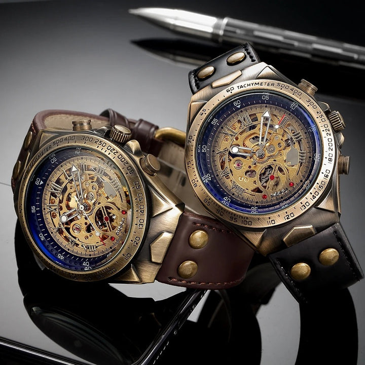 Elegant men's skeleton watch featuring an antique gold case, brown leather strap & visible mechanical movement.