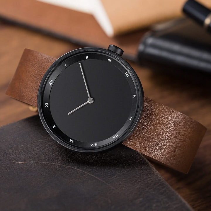 Classic men's quartz timepiece with a clean white dial, Roman numerals, and a versatile brown band.