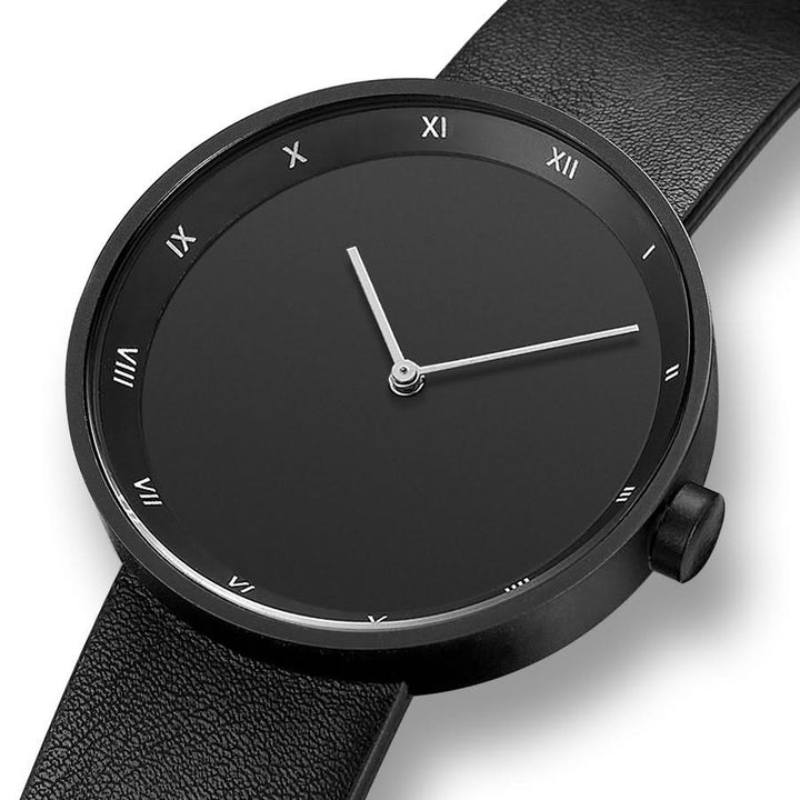 Gift for him: a classic men's minimalist watch with Roman numerals, available with brown or black band.