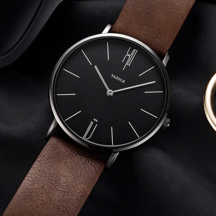 Sleek men's minimalist watch featuring a genuine leather band, perfect for casual or business attire.