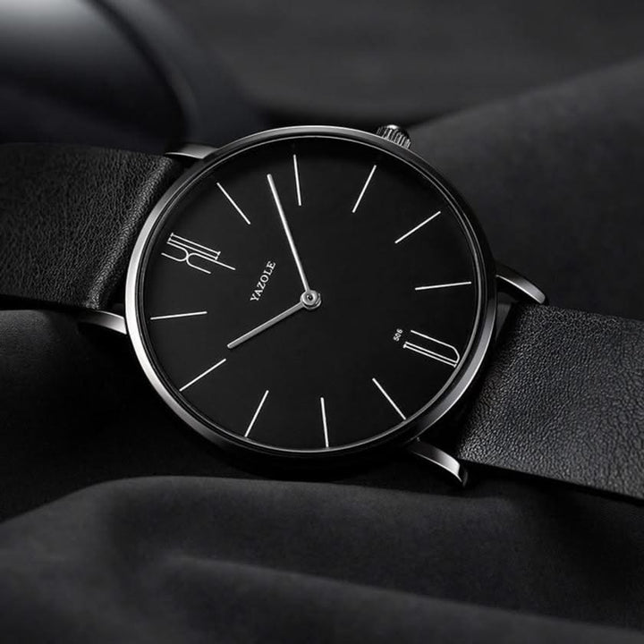 Stylish men's minimalist watch with a black leather band, offering a clean, modern, and elegant look.