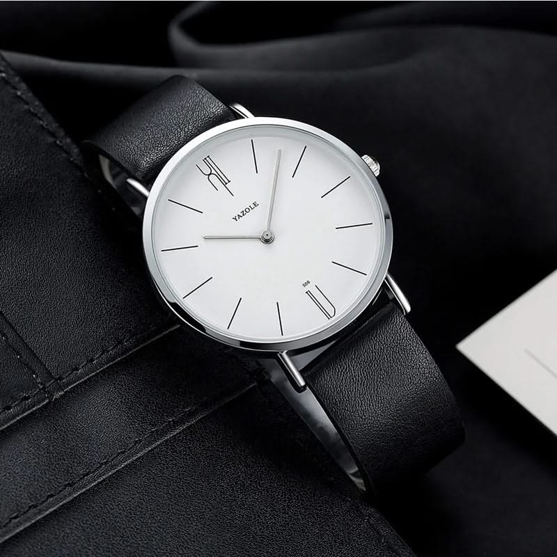Close-up of a men's classic watch showcasing its premium leather band and minimalist, easy-to-read dial.