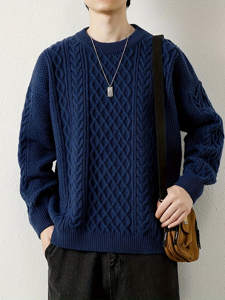 Classic navy men's cable knit jumper, an iconic piece for men's winter apparel.