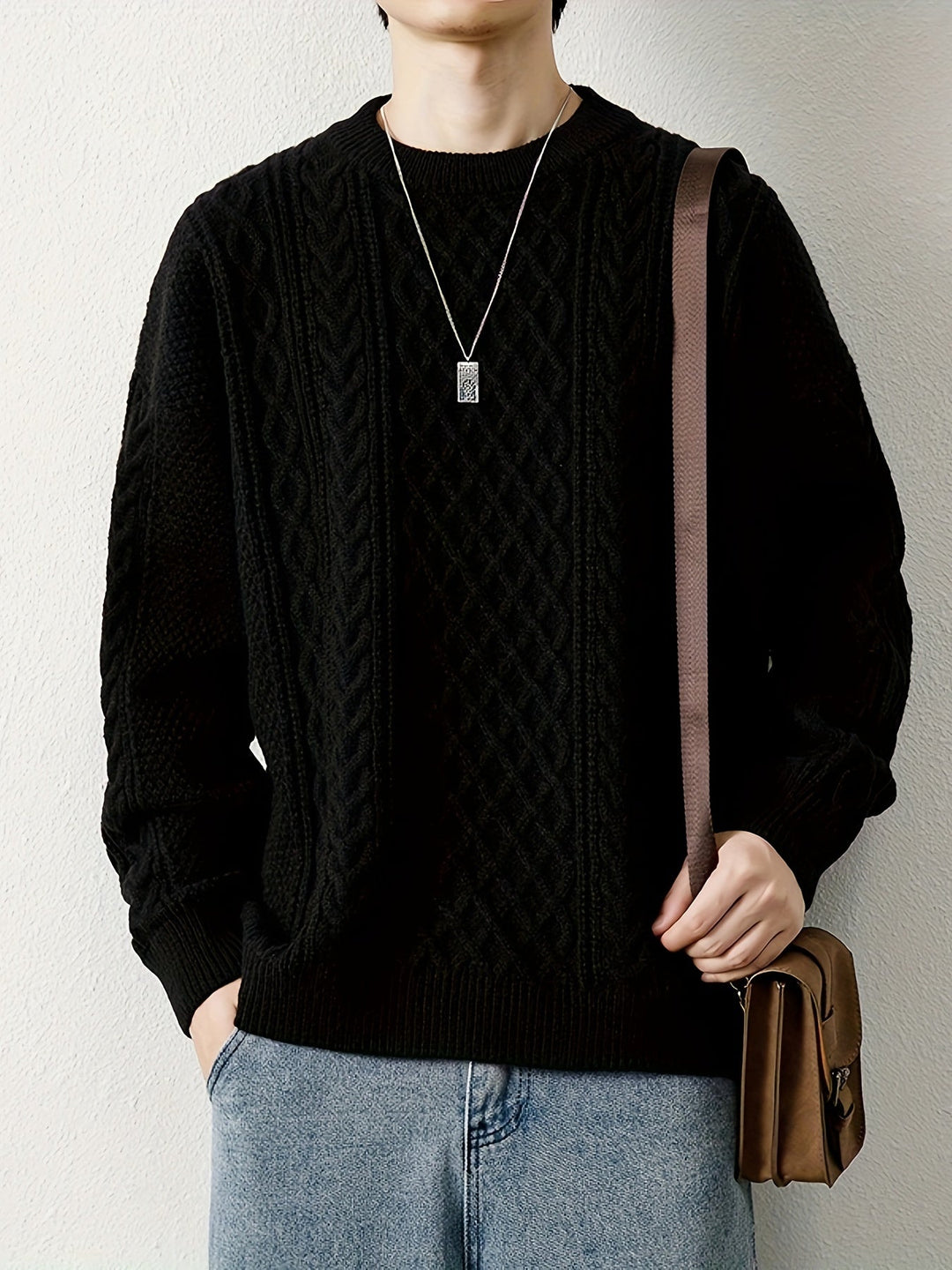 Men's classic cable knit jumper, offering both style and warmth for winter outfits.