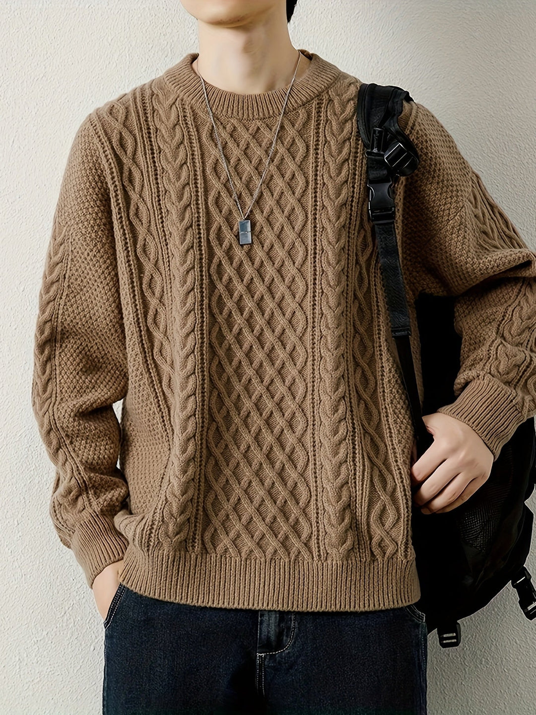 Stylish men's cream cable knit sweater, perfect for cozy wear and casual outfits.