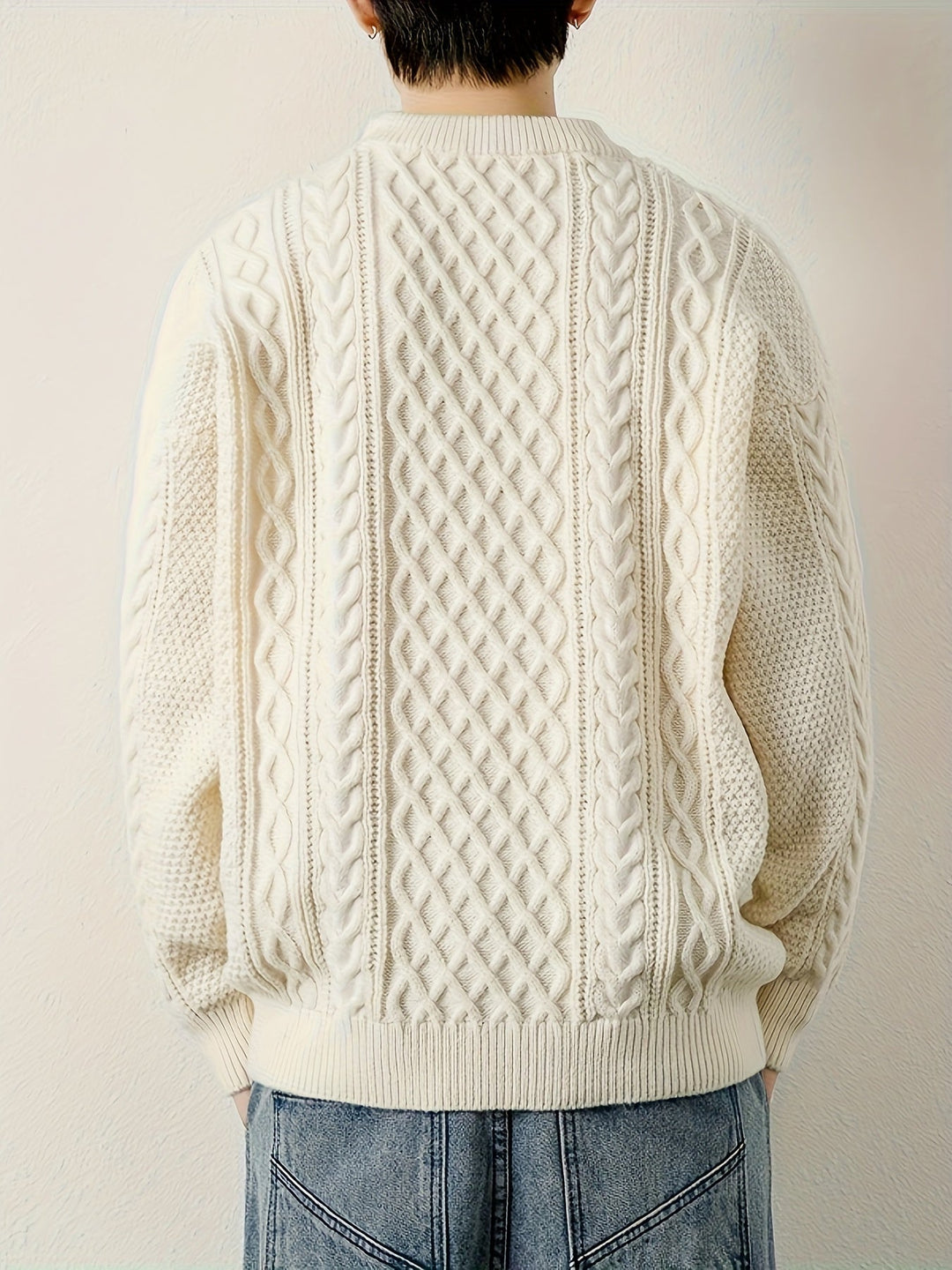 Men's elegant cable knit pullover, perfect for layering in cold weather.