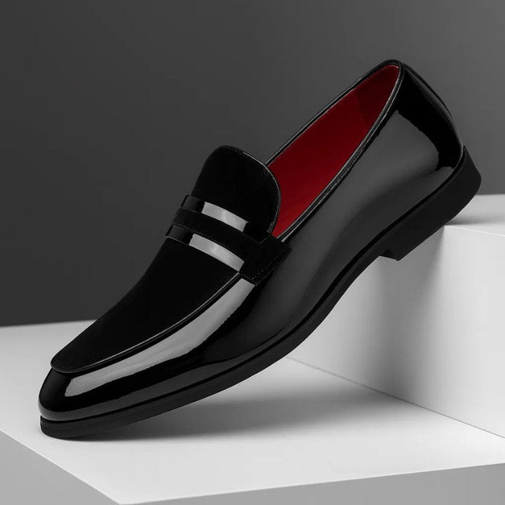 Detail shot of classic men's penny loafers, highlighting the polished finish and comfortable design.