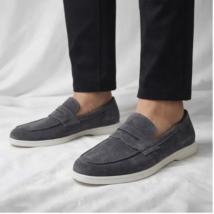 Classic brown men's penny loafers. Comfortable slip-on casual dress shoes for everyday style.
