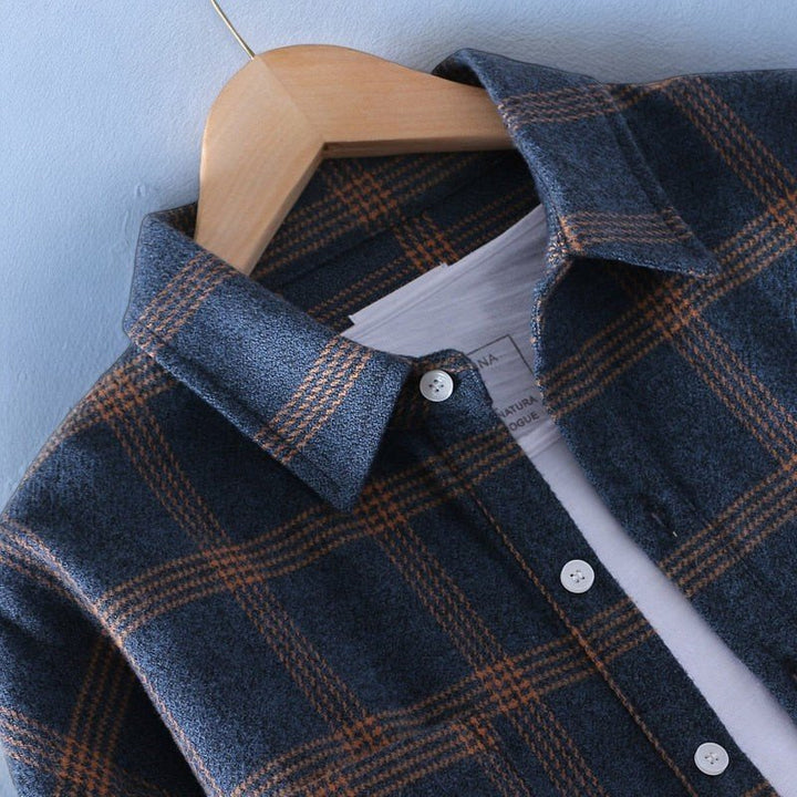 Timeless men's plaid button-up shirt with long sleeves, offering classic style for any casual occasion.