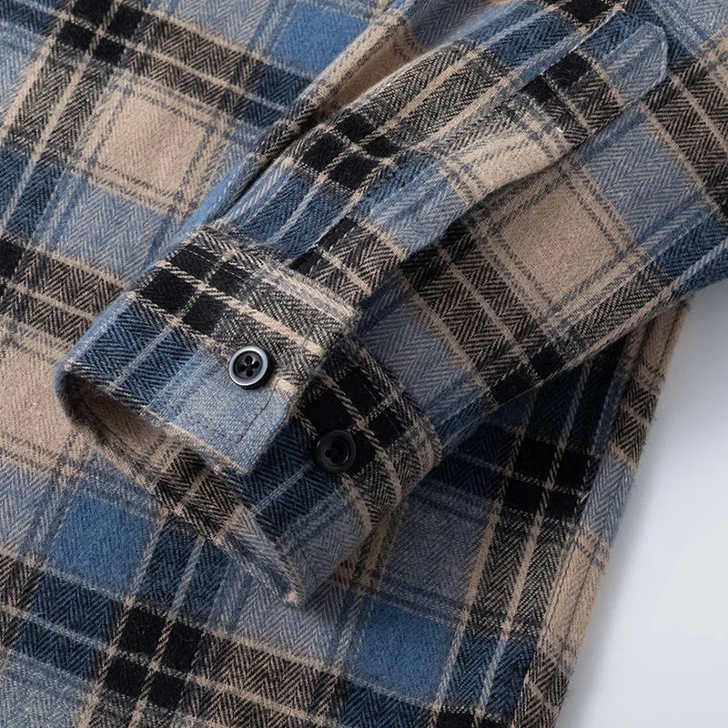Timeless men's plaid flannel button-up shirt in a classic pattern. Comfortable relaxed fit for fall.
