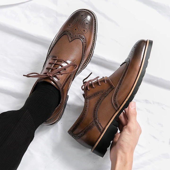 Classic brown polished leather men's brogue dress shoes, comfortable formal footwear.