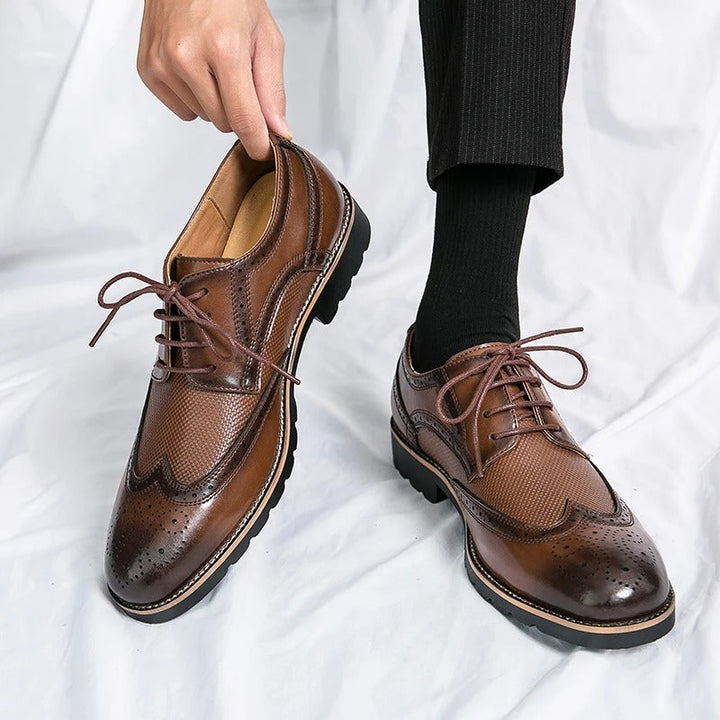 Comfortable men's classic polished leather brogue dress shoes, perfect for business and formal events.
