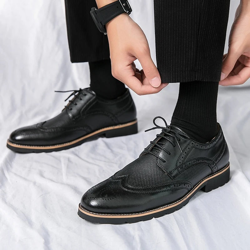 Sophisticated polished leather brogues for men, classic dress shoes suitable for any formal outfit.
