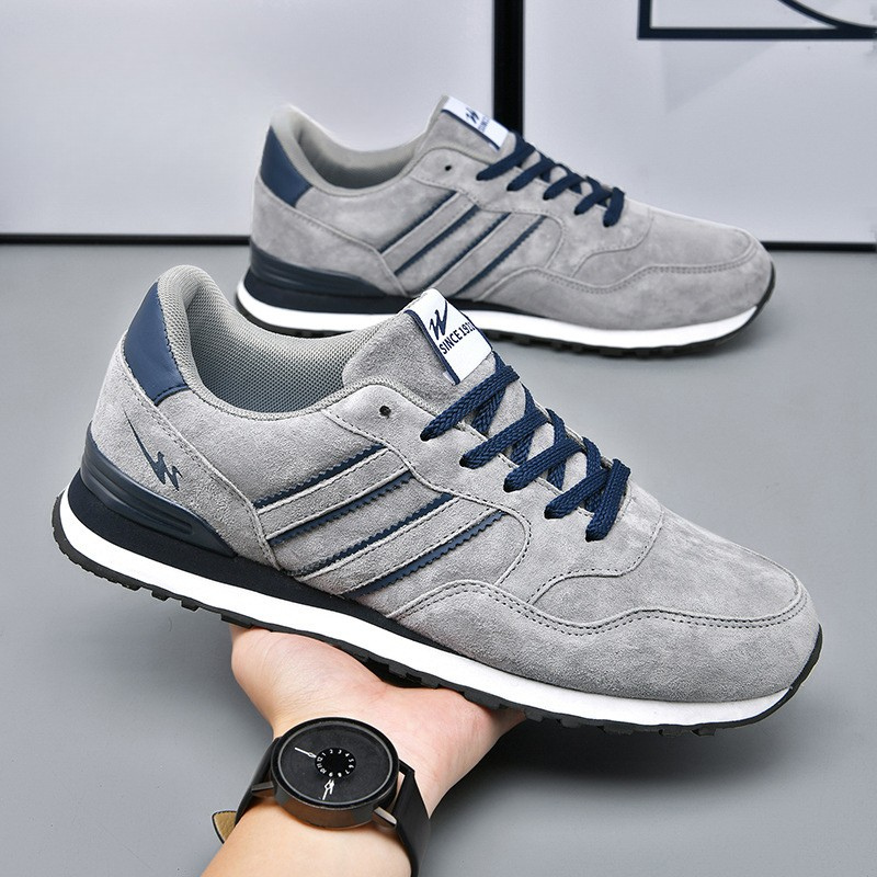 Vintage style men's sneakers, classic retro design for casual footwear. Everyday lace-up athletic shoes.