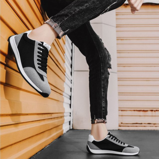 Men's athletic retro sneakers on foot, ready for versatile casual activities with cushioned support.