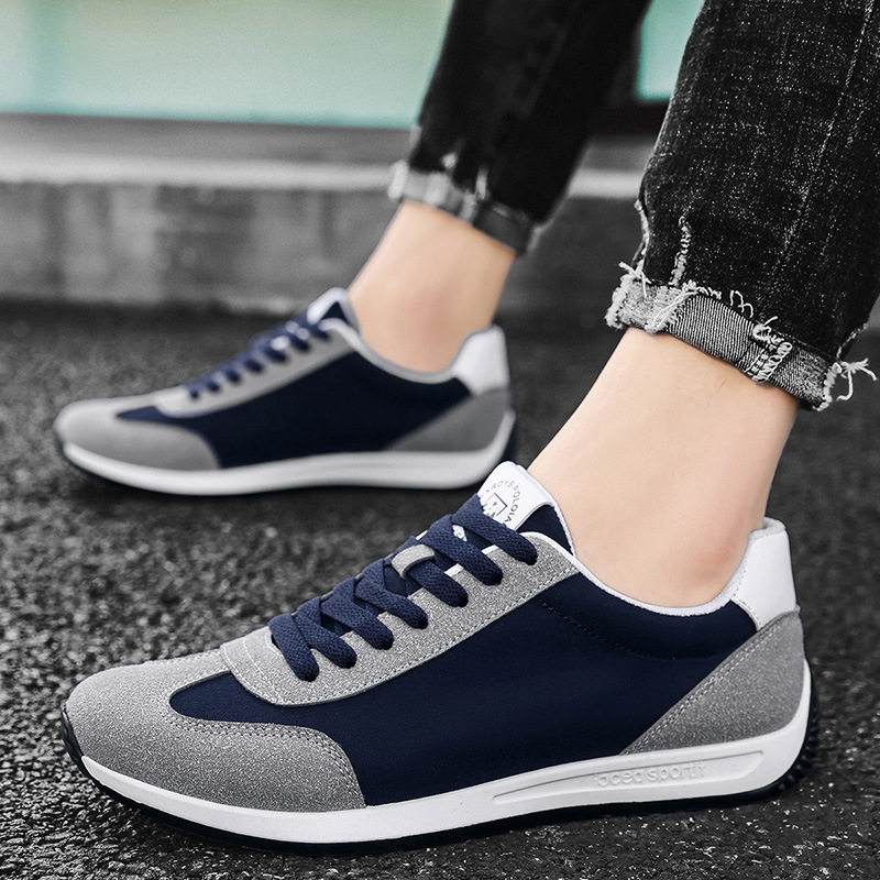Clean studio shot of men's retro comfort sneakers, highlighting classic athletic footwear style.