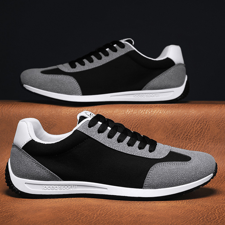 Top view of cushioned men's classic sneakers, highlighting material, craftsmanship & retro appeal.